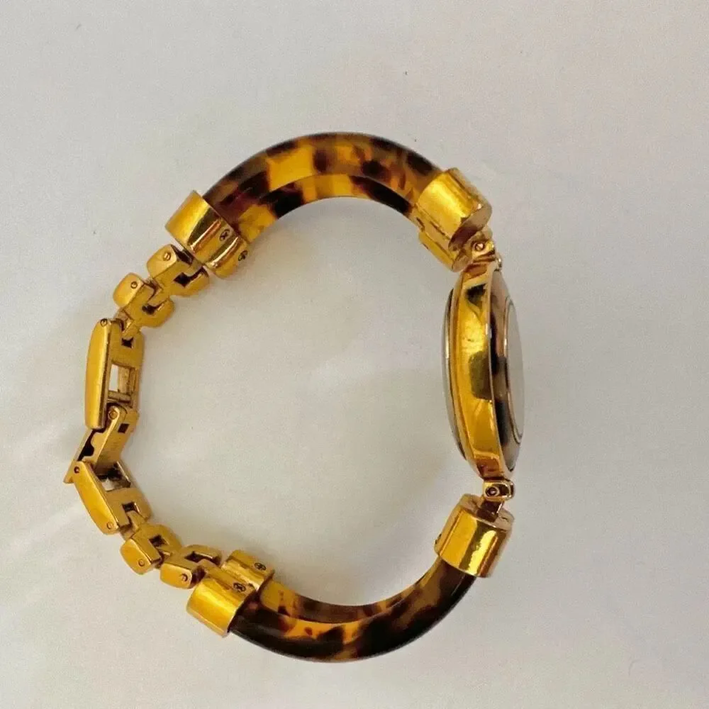 Avon faux tortoise vintage watch/ bracelet.